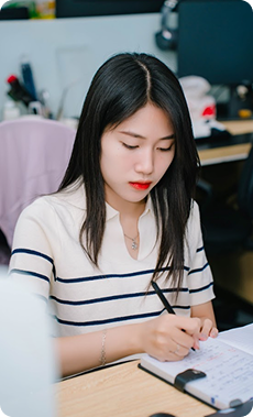 woman taking notes